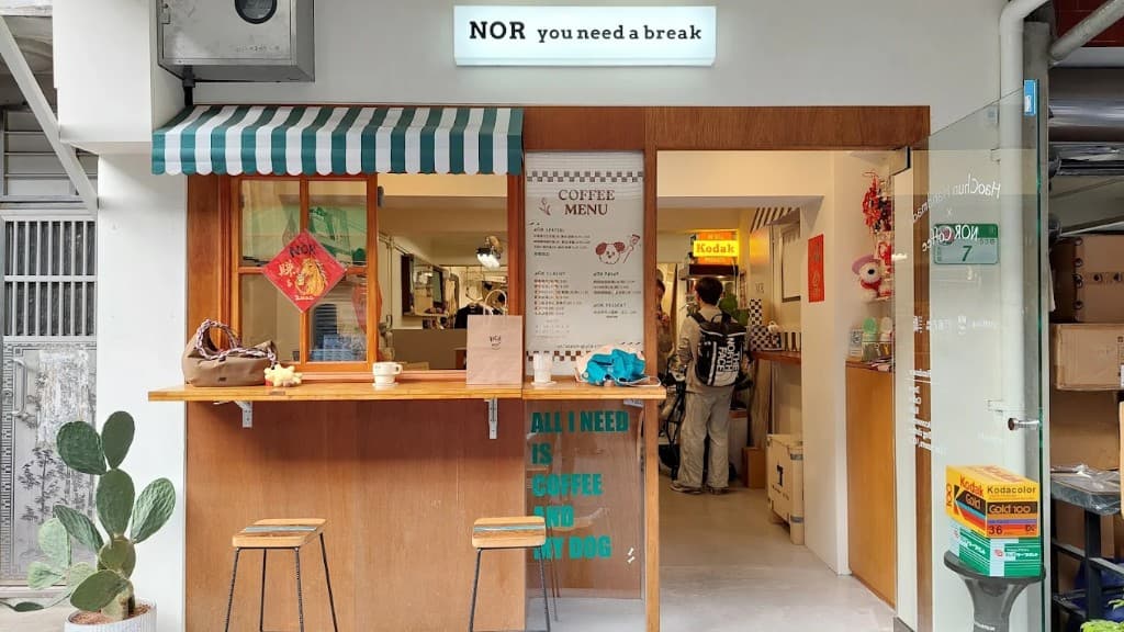 NOR Coffee storefront in Lane 53, Chifeng Street, Taipei — “NOR you need a break” lightbox sign, green-and-white striped awning and window counter